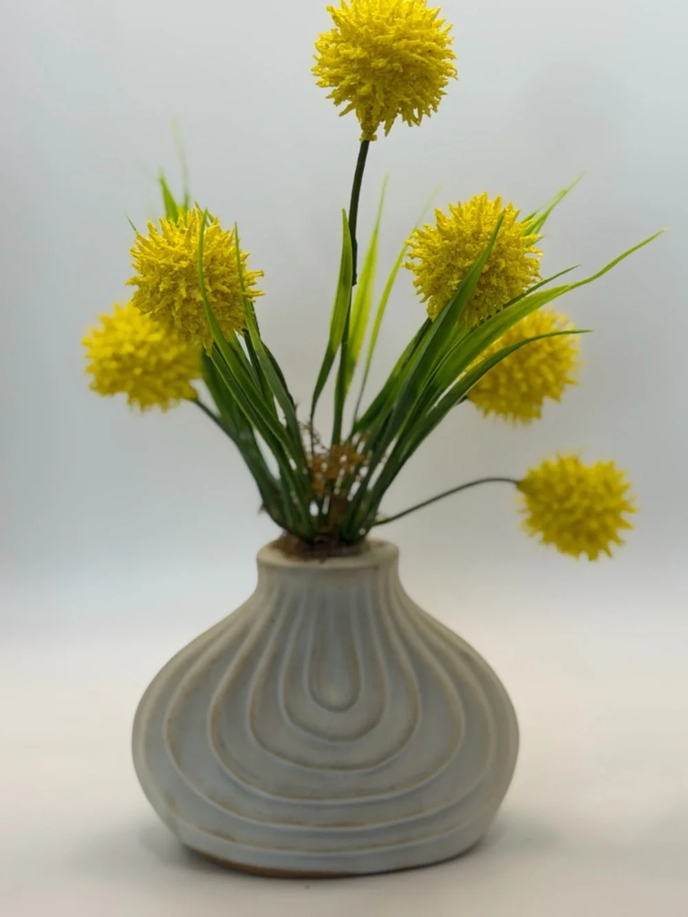 Yellow Pom-Pom Faux Floral Arrangement in Cream Ceramic Vase